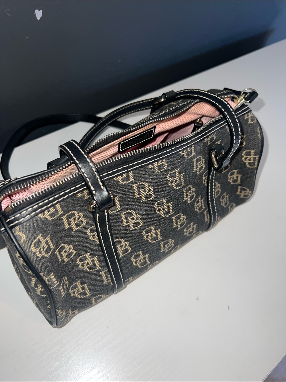 Dooney & Bourke Black and Beige Mini Barrel Bag with Pink Interior